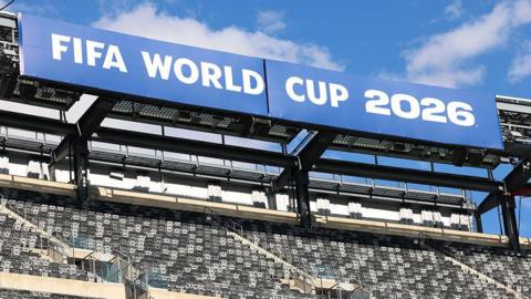 A sign reading Fifa World Cup 2026 is displayed in a stadium