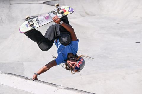 Sky Brown during the Women's Quarterfinal of the World Cup Rome 2026. She is seen performing a movement on her skateboard where she is upside down.