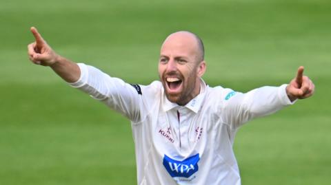 Jack Leach celebrates taking a wicket for Somerset