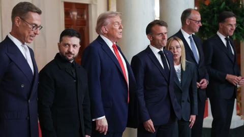 From left to right: Finnish President Alexander Stubb, Ukrainian President Volodymyr Zelensky, US President Donald Trump, French President Emmanuel Macron, Italian Prime Minister Giorgia Meloni, German Chancellor Friedrich Merz, and Nato secretary general Mark Rutte are pictured at the White House in Washington DC on 18 August, 2025. 