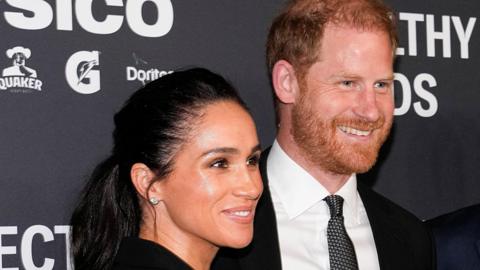 Duchess and Duke of Sussex, head and shoulders, in a pic in New York