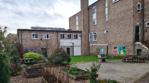 A general view picture of the Willow House site, a grey four-storey building.