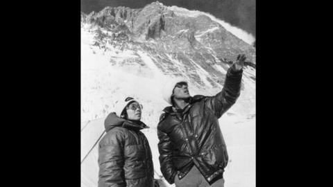 Junko Tabei with Ang Tsering standing in front of the southern wall of Mount Everest.
