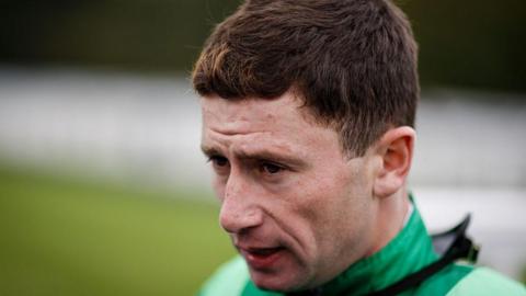 Oisin Murphy poses at Salisbury Racecourse on October 02, 2025 in Salisbury, England. 