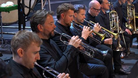 Brass musicians playing in an orchestra