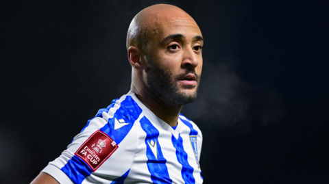 Nathan Redmon wearing Sheffield Wednesday's white and blue striped home shirt during their FA Cup third-round tie against Portsmouth in January