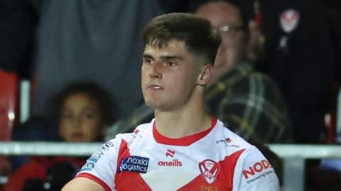 Jon Bennison pictured in a St Helens shirt with fans watching on