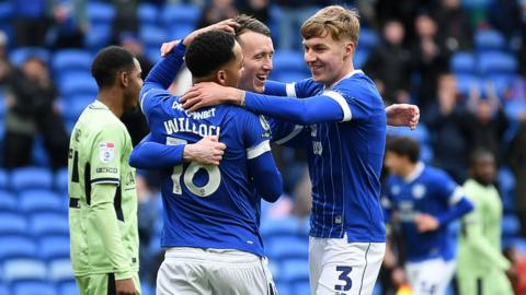 Cardiff players celebrate opening goal