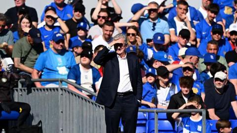 Roy Hodgson on the sideline with his hand over his eyes to help him see the pitch at St. Andrew's during Bristol City's 2-1 loss to Birmingham City