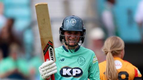 Oval Invincibles' Paige Scholfield celebrates her half-century against Birmingham Phoenix