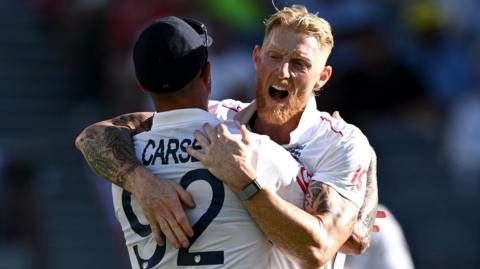 England captain Ben Stokes hugs Jofra Archer to celebrate taking a wicket