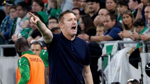 Ferencvaros manager Robbie Keane pointing and shouting