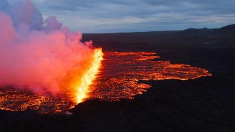 Aerial view of flaming volcanic eruption