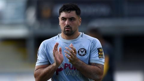 Newport County goalkeeper Nick Townsend applauds