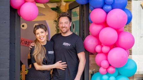 Gillian and her husband outside the play space