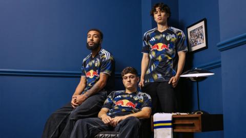 Leeds United 2025-26 third kit launch with three players wearing the strip