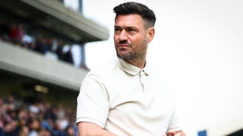 AFC Wimbledon boss Johnnie Jackson 