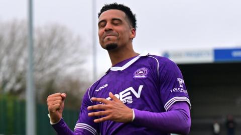 Louis Dennis celebrates