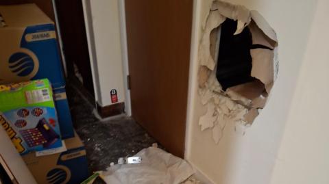 Hole in the wall at the food bank.