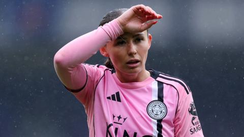Hannah Cain with hand across forehead
