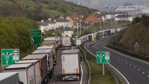 Lorries queued up on a busy motorway. 