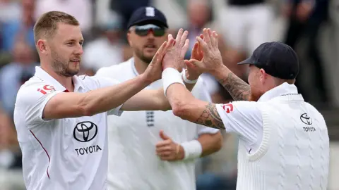 England fast bowler Gus Atkinson celebrates taking a wicket