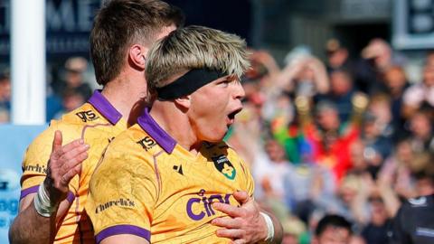 Henry Pollock celebrates a try