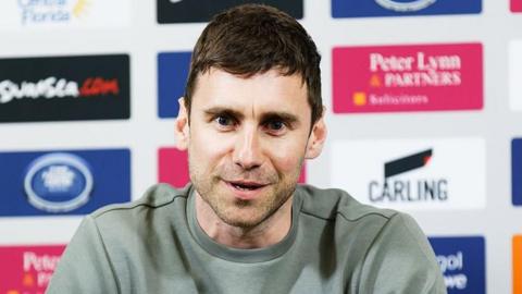 Richard Montague sits at his press conference when he joined Swansea City
