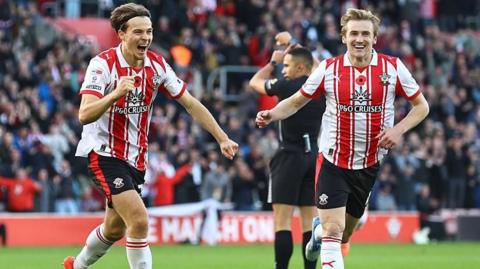 Caspar Jander (left) and Flynn Downes celebrate after Southampton score at St Mary's Stadium