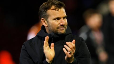 Tom Cleverley claps at the end of a game