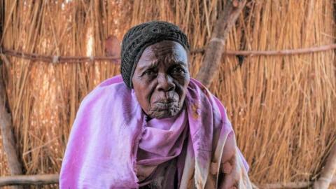 An elderly woman in a camp for internally displaced people in Sudan