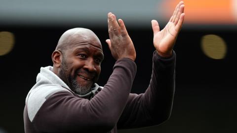 Darren Moore celebrating his latest side Port Vale's promotion to League One
