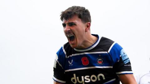 Ewan Richards shouts in celebration of a try 