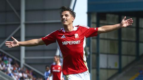Tom Nichols celebrates his goal at Oldham