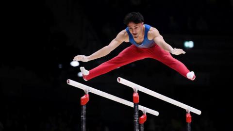 Jake Jarman in action on the parallel bars