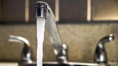 Stock image of water running from tap