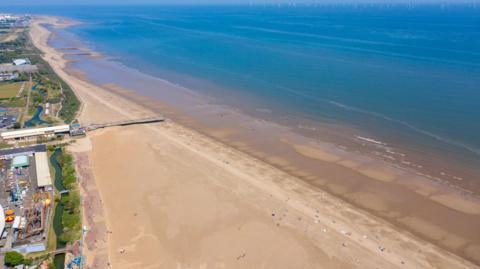 A stock photograph - an aerial shot of Skegness beach on a sunny day.