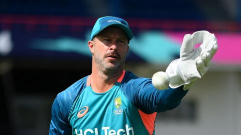 Matthew Wade catches a ball one-handed during training for Australia