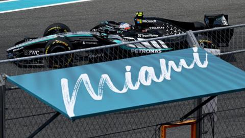 Kimi Antonelli drives past a Miami sign 