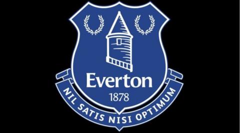 The Everton crest which includes the date 1878 and the latin slogan Nil Satis Nisi Optimum