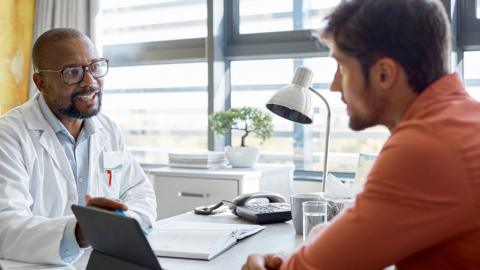 A man talking with a doctor