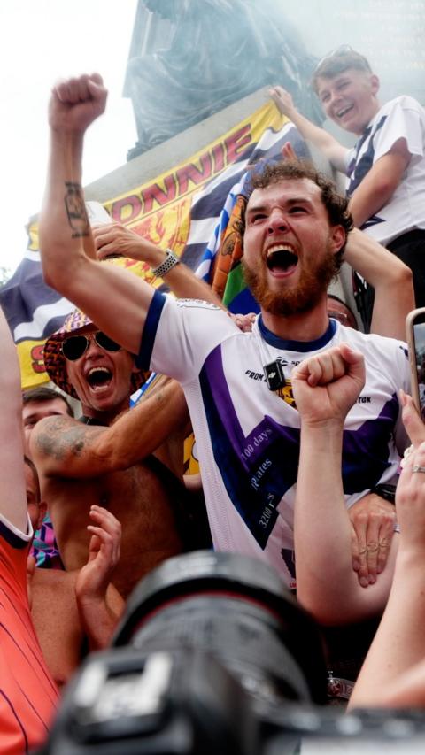 Man in Scotland top cheering among fans
