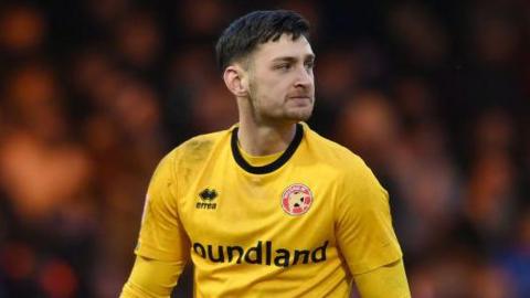 Jackson Smith playing in goal for Walsall