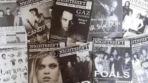 Several issues of Nightshift laid out on display. Glimpsed among the covers are bands like Glass Animals, Stornoway, Ride, and Foals.