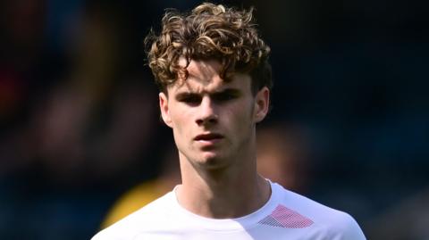 Harry Gray, wearing Rotherham United's white away shirt, during a game against Wycombe Wanderers in May 2026