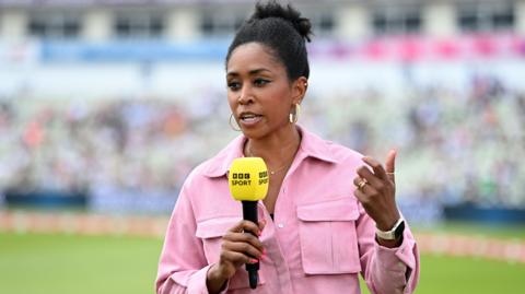 Ebony Rainford-Brent holding a BBC Sport microphone at an England women's T20 international against Pakistan