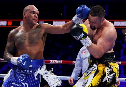 Fabio Wardley throws a punch at Joseph Parker