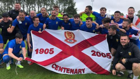 Jersey football team celebrate winning an Island Games gold medal