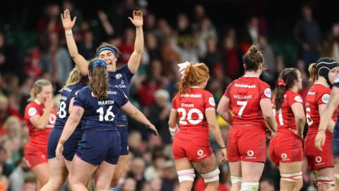 Scotland players celebrate victory over Wales in Cardiff