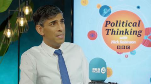 Rishi Sunak, in a white shirt and blue tie, speaks on BBC's Political Thinking podcast